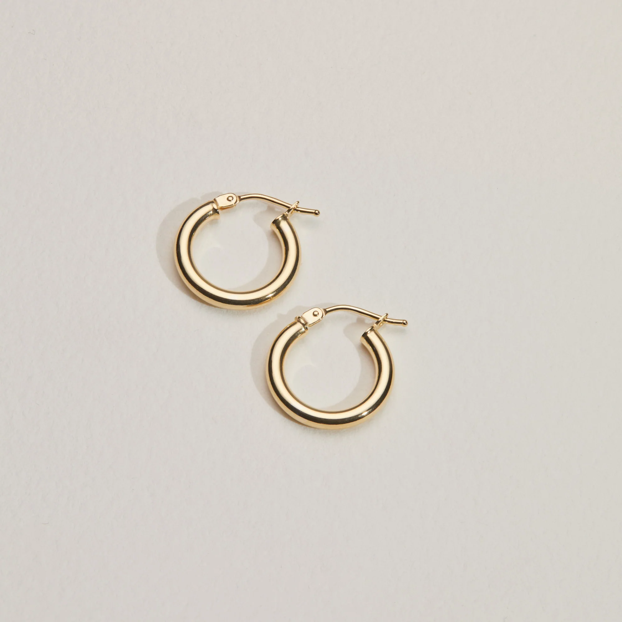Solid Gold Small Rounded Hoop Earrings - Image 8