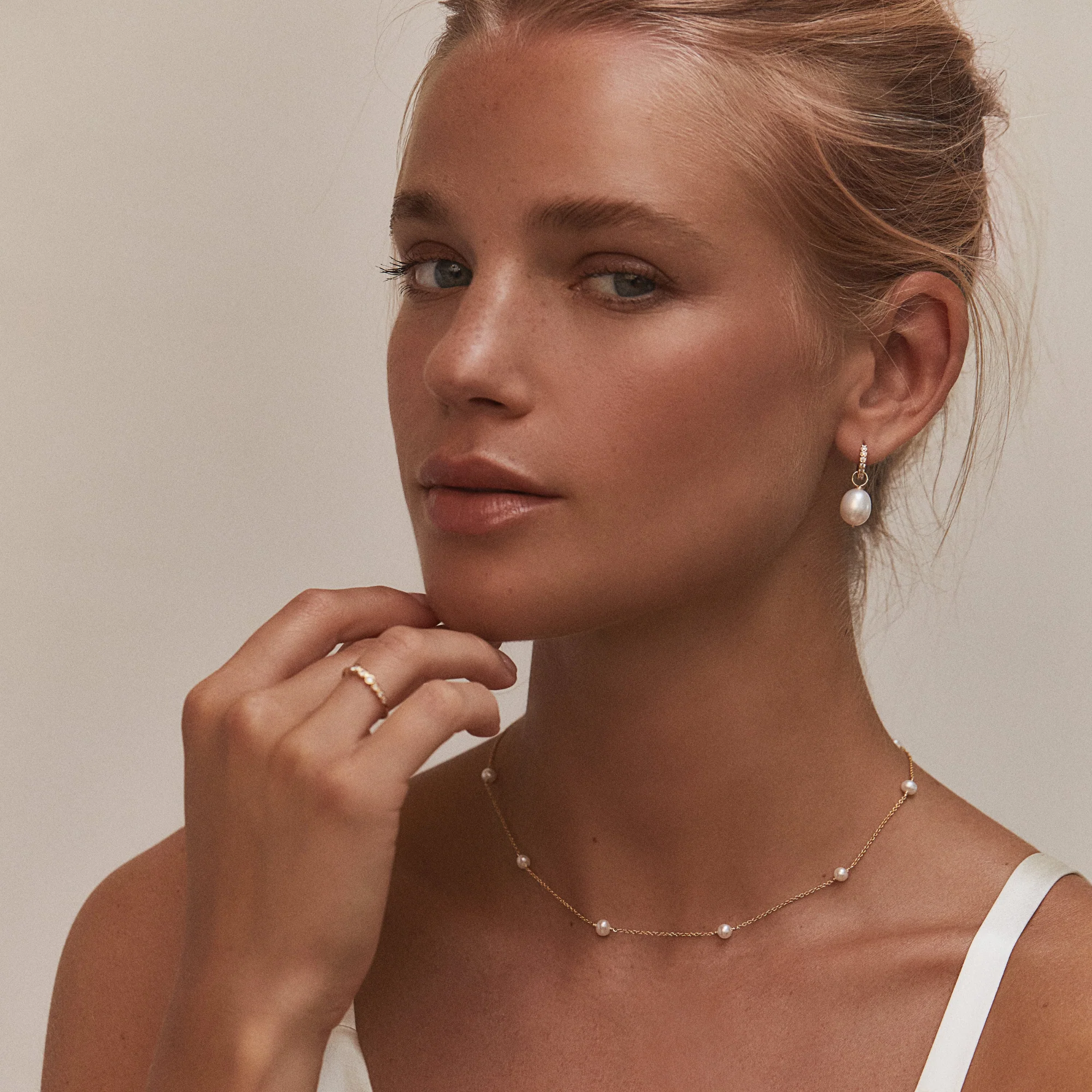 Gold Huggie Pearl Drop Earrings - Image 9