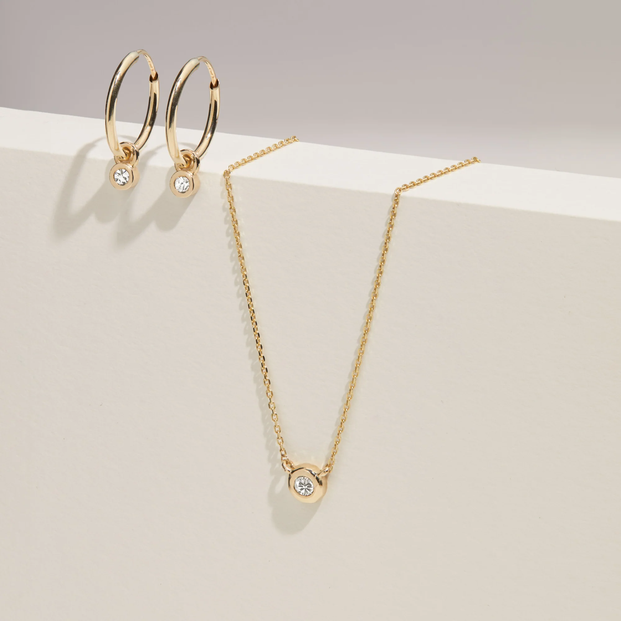 Solid Gold Mini Floating Diamond Hoop Earrings - Image 6